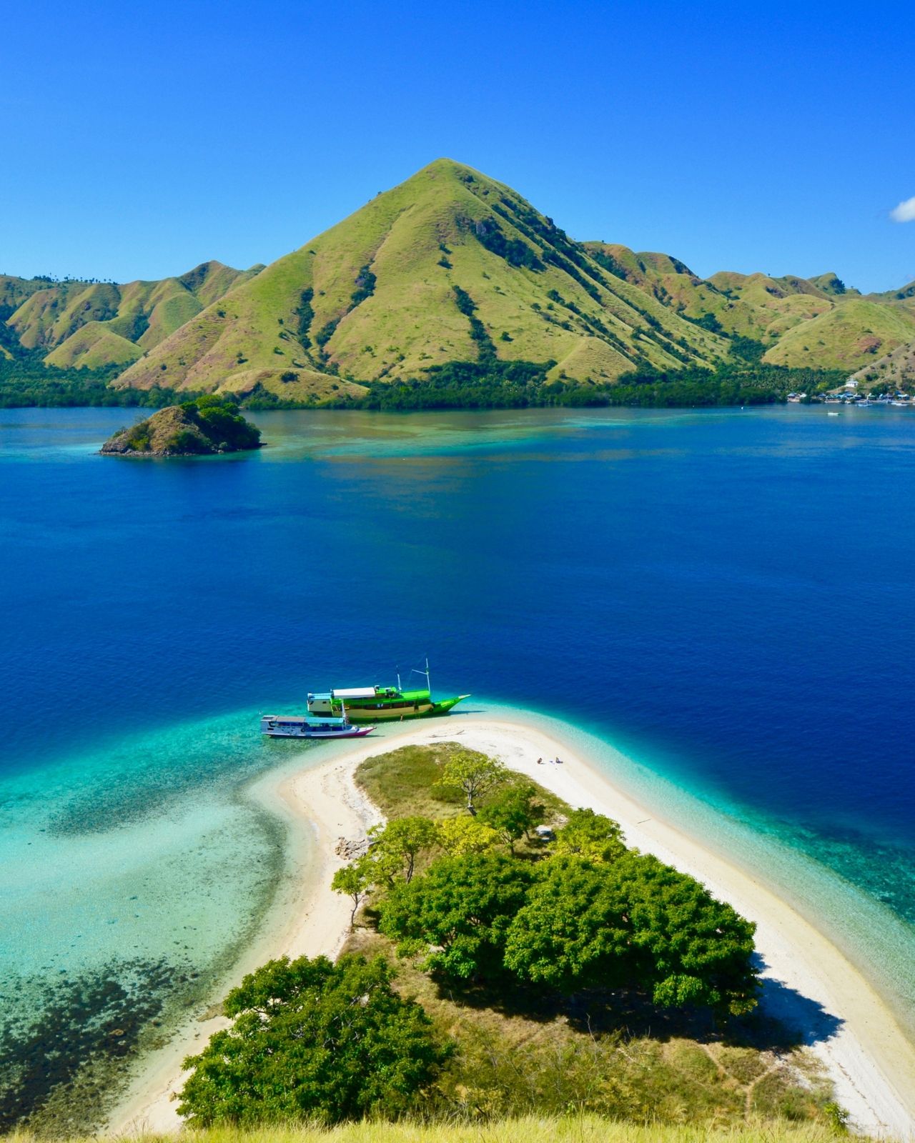 Island sandbar surrounded by blue water