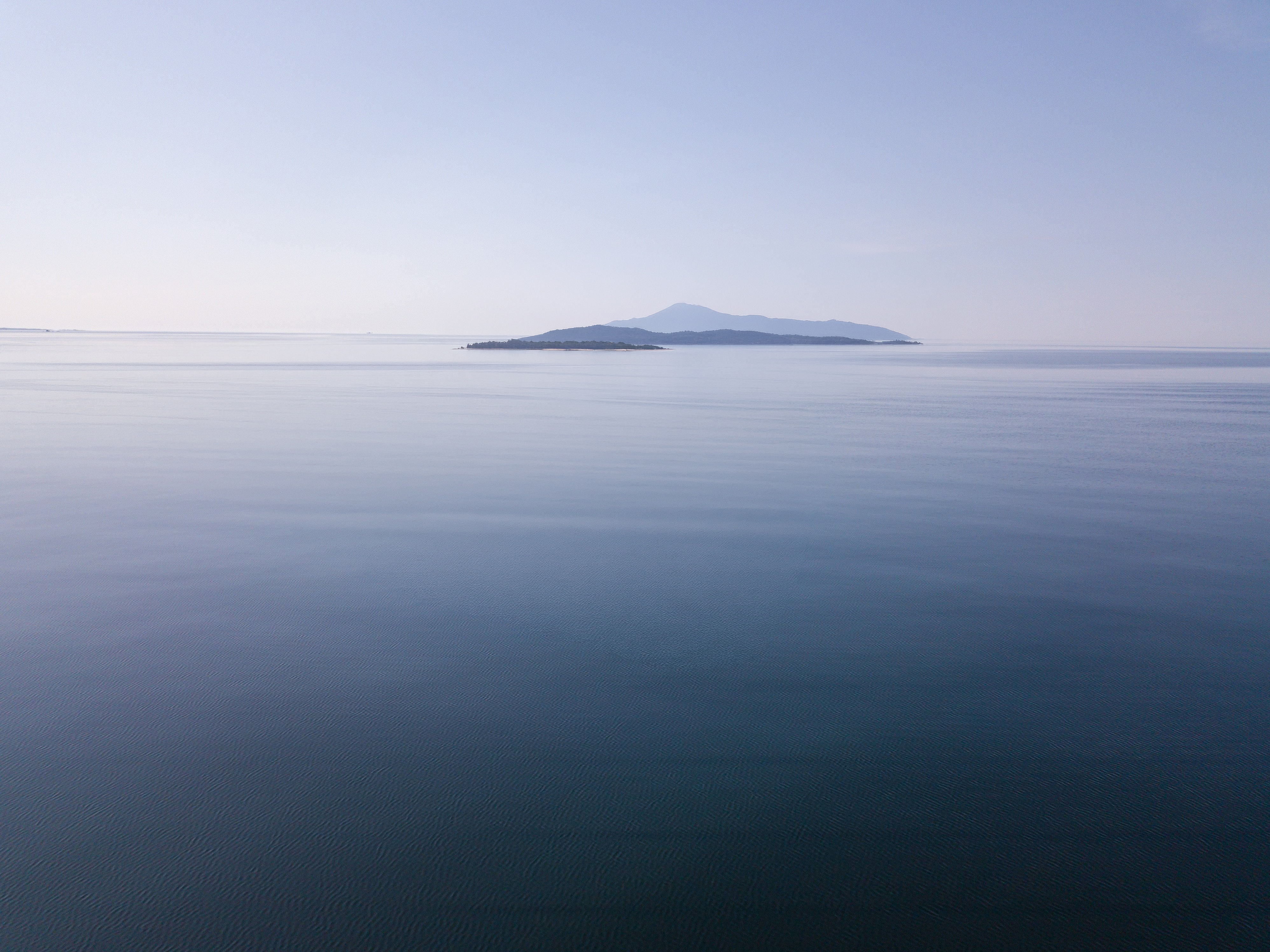 Calm sea and island horizon